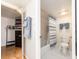 Bathroom featuring a shower, toilet, linen closet, and light blue accents at 640 Bayway Blvd # 302, Clearwater Beach, FL 33767