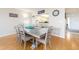 Cozy dining room features a large table, seating for six, and views into the kitchen at 640 Bayway Blvd # 302, Clearwater Beach, FL 33767