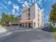 Exterior of a condominium building with multiple levels, balconies, and covered parking at 640 Bayway Blvd # 302, Clearwater Beach, FL 33767