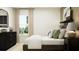 Serene bedroom showcasing a comfortable bed, decorative pillows, and elegant furnishings at 6462 Propel Run, New Port Richey, FL 34655