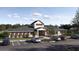 Community clubhouse with ample parking spaces and welcoming facade at 6480 Propel Run, New Port Richey, FL 34655