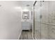 Modern bathroom featuring a stylish vanity and a glass-enclosed shower at 6612 W Chelsea St, Tampa, FL 33634