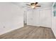 This bedroom has wood-look floors and a closet with sliding doors at 6612 W Chelsea St, Tampa, FL 33634