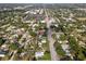 Aerial view of home nestled among lush greenery, highlighting its location along a tree-lined street at 7201 5Th N Ave, St Petersburg, FL 33710