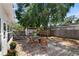 Charming backyard features a wooden deck, chairs, a fire pit, and a serene hammock area for relaxation at 7201 5Th N Ave, St Petersburg, FL 33710