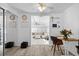 Open dining area with modern decor, light wood floors, and seamless transition to the living room at 7201 5Th N Ave, St Petersburg, FL 33710