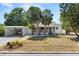Charming single-story home with mature palm trees, a covered porch, and a well-maintained front yard at 7201 5Th N Ave, St Petersburg, FL 33710