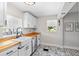Charming kitchen showcasing white cabinetry, butcher block counters, and stylish flooring at 7201 5Th N Ave, St Petersburg, FL 33710