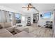 Bright and airy living room with modern flooring, comfortable seating, and ample natural light at 7201 5Th N Ave, St Petersburg, FL 33710