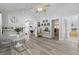 Spacious living room featuring modern decor, light-colored laminate flooring, and ample natural light at 7201 5Th N Ave, St Petersburg, FL 33710