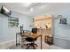 Comfortable home office featuring built-in shelving, modern desk, and stylish decor at 7201 5Th N Ave, St Petersburg, FL 33710