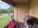 Outdoor patio area featuring a grill, patio furniture, and access to the backyard at 7221 Sterling Point Ct, Gibsonton, FL 33534