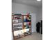 Spacious room with decorative shelves filled with various sewing accessories and fabrics near a white door at 8009 Trimbelle Ter, Parrish, FL 34219
