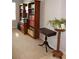 Cozy room with carpeted floors, a wooden bookcase, and natural light from a window at 8009 Trimbelle Ter, Parrish, FL 34219