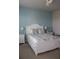 Cozy bedroom featuring a white bed frame, nautical bedding, and light blue walls at 8009 Trimbelle Ter, Parrish, FL 34219