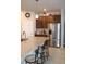 Open kitchen with granite countertops, stainless steel appliances, and breakfast bar at 8009 Trimbelle Ter, Parrish, FL 34219