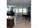 Open concept living room features tile floors, neutral paint, and comfortable seating at 8009 Trimbelle Ter, Parrish, FL 34219