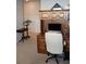 Bright home office with built-in wooden desk, cabinets, and white chair at 8009 Trimbelle Ter, Parrish, FL 34219