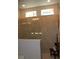 Walk in shower with brown tile walls, glass doors and seat at 8009 Trimbelle Ter, Parrish, FL 34219