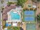 Aerial view of community pool, playground, basketball and tennis courts, and gathering areas at 815 Sandy Trail Pl, Brandon, FL 33511