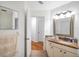 Bathroom with hardwood flooring, vanity and framed mirror at 815 Sandy Trail Pl, Brandon, FL 33511