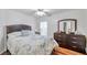 Comfortable bedroom with dresser, window and natural light, and decorative bedding at 815 Sandy Trail Pl, Brandon, FL 33511