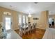 Elegant dining room features hardwood floors, a chandelier, and ample natural light at 815 Sandy Trail Pl, Brandon, FL 33511