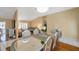 A dining room with hardwood floors, a chandelier, and a table with seating for six at 815 Sandy Trail Pl, Brandon, FL 33511