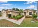 Charming home with a well-kept lawn, two-car garage, and colorful landscaping at 815 Sandy Trail Pl, Brandon, FL 33511