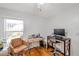 Home office featuring two desks, an office chair, and natural light from a window at 815 Sandy Trail Pl, Brandon, FL 33511