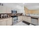 Well-equipped kitchen featuring granite counters, stainless appliances, and ample cabinet space at 815 Sandy Trail Pl, Brandon, FL 33511