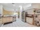 Open concept kitchen with stainless steel appliances and bright lighting at 815 Sandy Trail Pl, Brandon, FL 33511