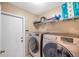 Laundry room with modern washer and dryer at 815 Sandy Trail Pl, Brandon, FL 33511