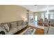 Comfortable living room and dining area with wood floors and neutral decor at 815 Sandy Trail Pl, Brandon, FL 33511