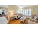 A cozy living room with a comfortable sofa set, beautiful hardwood floors, plantation shutters, and stylish decor at 815 Sandy Trail Pl, Brandon, FL 33511