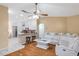 Bright living room open to the kitchen featuring a modern white leather sofa at 815 Sandy Trail Pl, Brandon, FL 33511