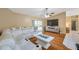 Comfortable living room with a vaulted ceiling, hardwood floors, and sliding door access to pool at 815 Sandy Trail Pl, Brandon, FL 33511