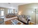 Inviting living room and dining area featuring wood floors and lots of natural light at 815 Sandy Trail Pl, Brandon, FL 33511