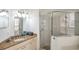 Nicely appointed primary bathroom features granite counters, tile floors, and enclosed glass shower at 815 Sandy Trail Pl, Brandon, FL 33511