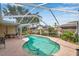 A beautiful screened-in pool featuring ample patio space and a tranquil setting for relaxation and entertainment at 815 Sandy Trail Pl, Brandon, FL 33511