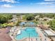 Community pool with palm trees, lounge chairs, and a splash pad in a Gathering-friendly neighborhood at 815 Sandy Trail Pl, Brandon, FL 33511
