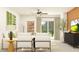 Bright living room features stylish neutral furniture, decor and natural light at 8620 Linked Dr, New Port Richey, FL 34655