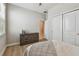 Bright, comfortable bedroom with wood flooring and neutral decor at 8772 Flourish Dr, Land O Lakes, FL 34637