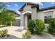Inviting front entrance with manicured landscaping and stylish architectural details at 8772 Flourish Dr, Land O Lakes, FL 34637