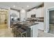 Modern kitchen with stainless steel appliances, granite counters, and a breakfast bar at 8772 Flourish Dr, Land O Lakes, FL 34637