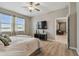 Bedroom with a ceiling fan, two windows, and a doorway to another room at 8772 Flourish Dr, Land O Lakes, FL 34637