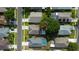 Overhead view highlighting home's lot and surrounding neighborhood; mature landscaping and backyard pools at 8812 Beeler Dr, Tampa, FL 33626