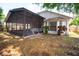 Backyard with a screened patio and bay window, perfect for relaxing outdoors at 8812 Beeler Dr, Tampa, FL 33626