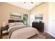 Staged bedroom showcasing furniture, decor, and artwork, enhancing the room's character and functional design at 8812 Beeler Dr, Tampa, FL 33626