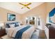 Bedroom with wood floors, a vaulted ceiling, and a bay window, virtually staged with a bed at 8812 Beeler Dr, Tampa, FL 33626